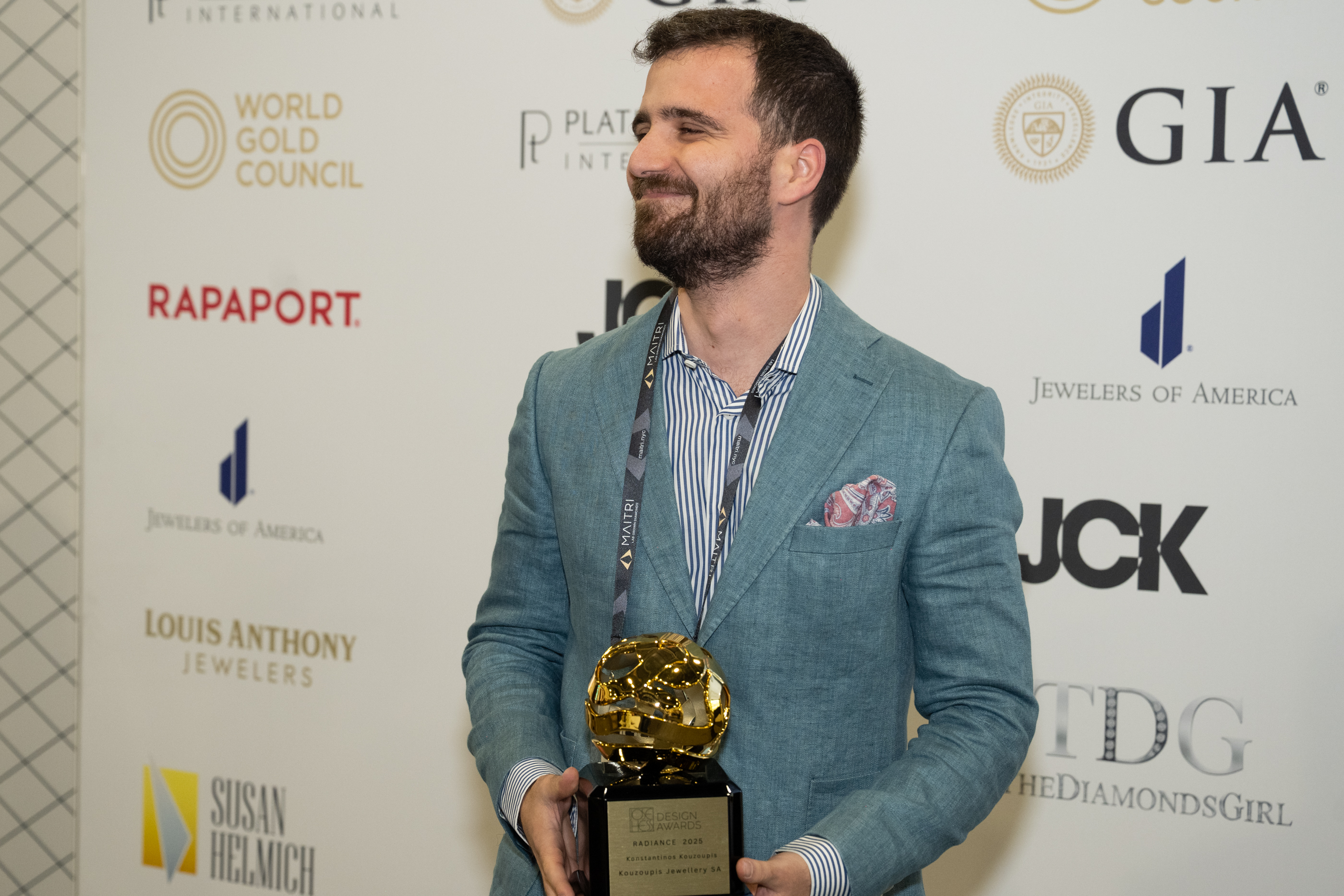 Antonis Kouzoupis holding the Radiance 2025 award